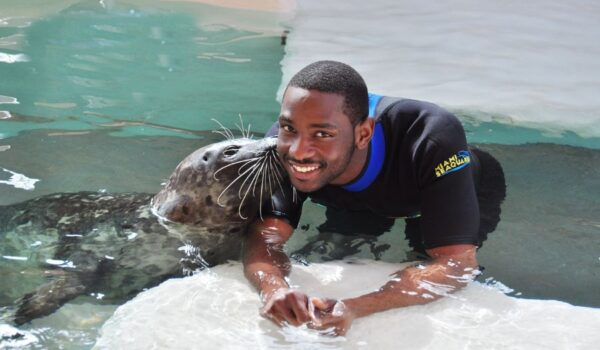 Man with a seal at Miami Seaquarium