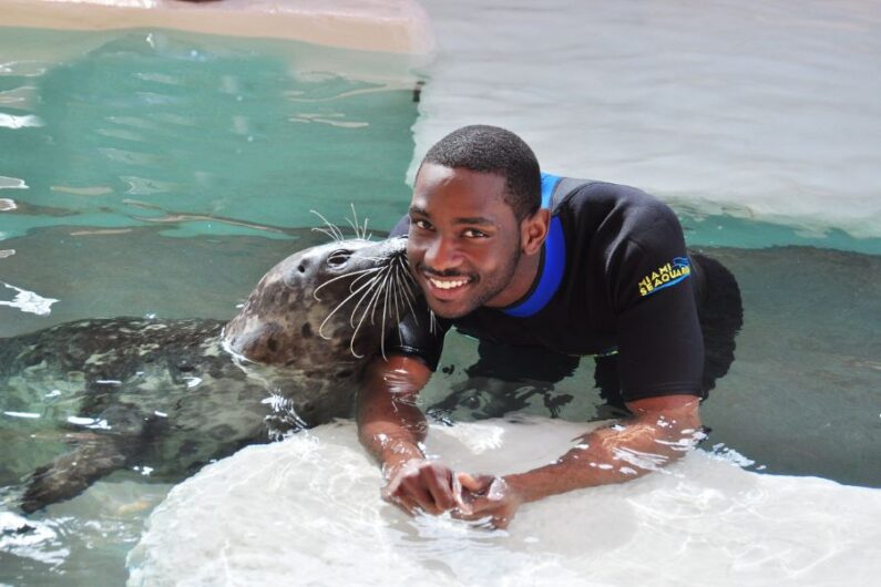 Man with a seal at Miami Seaquarium